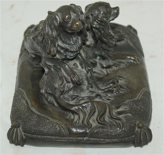 A late 19th / early 20th century patinated bronze group modelled as two spaniels, 8.5in.